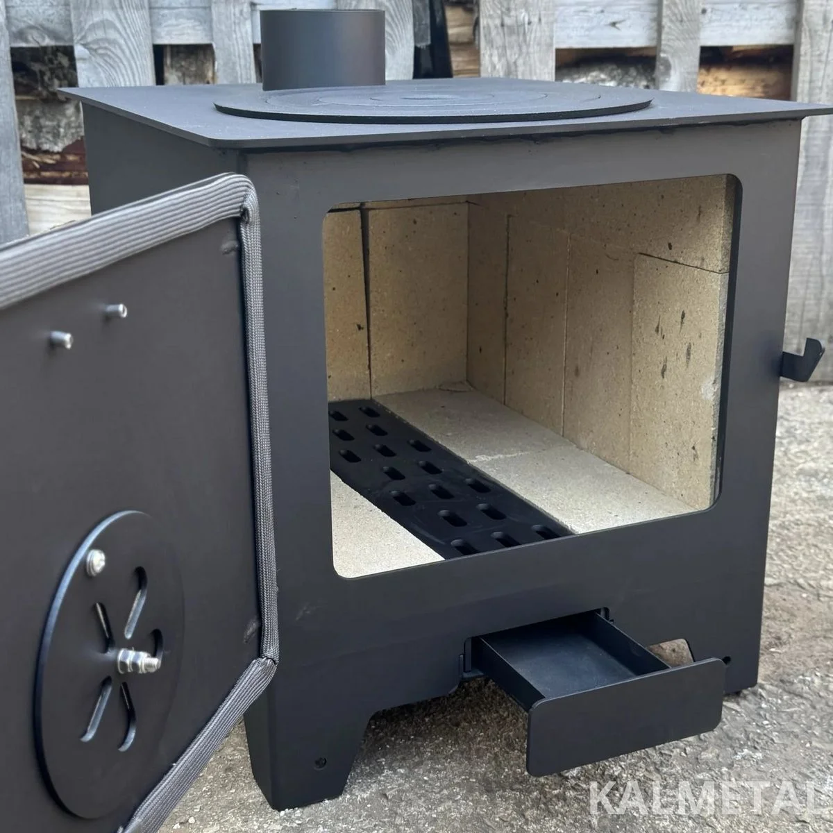 Stufa a legna 8 kW con camera in chamotte e tubi di raccordo - immagine 9